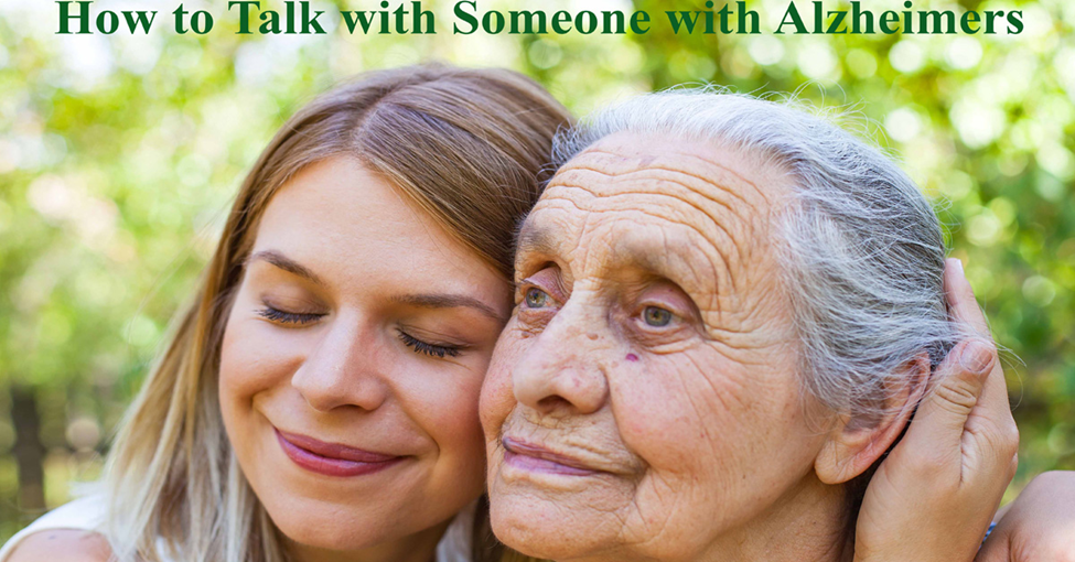 How to Talk with Someone with Alzheimers. Picture of a young caucasian woman hugging an elderly caucasian woman.